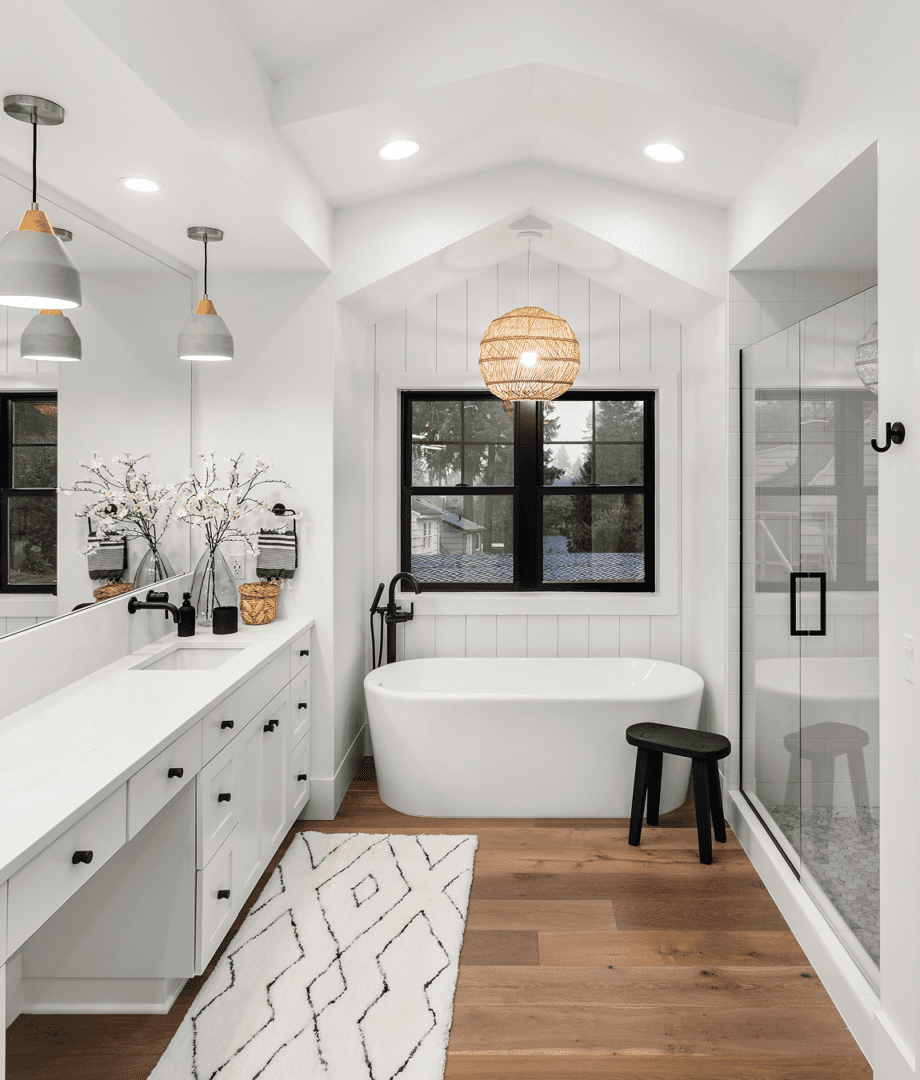 Elegant bathroom with pendant lights and rug