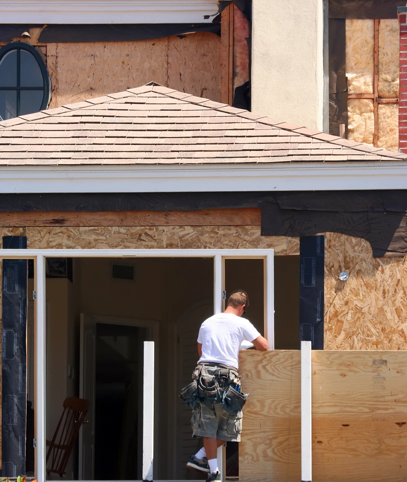 Engineers reviewing construction plans outdoors
